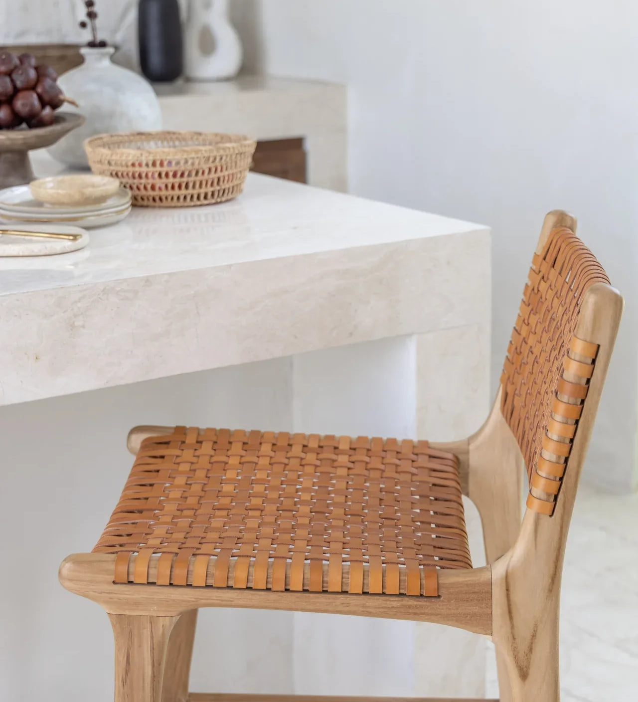 leather and teak kitchen stool in a white kitchen in bali