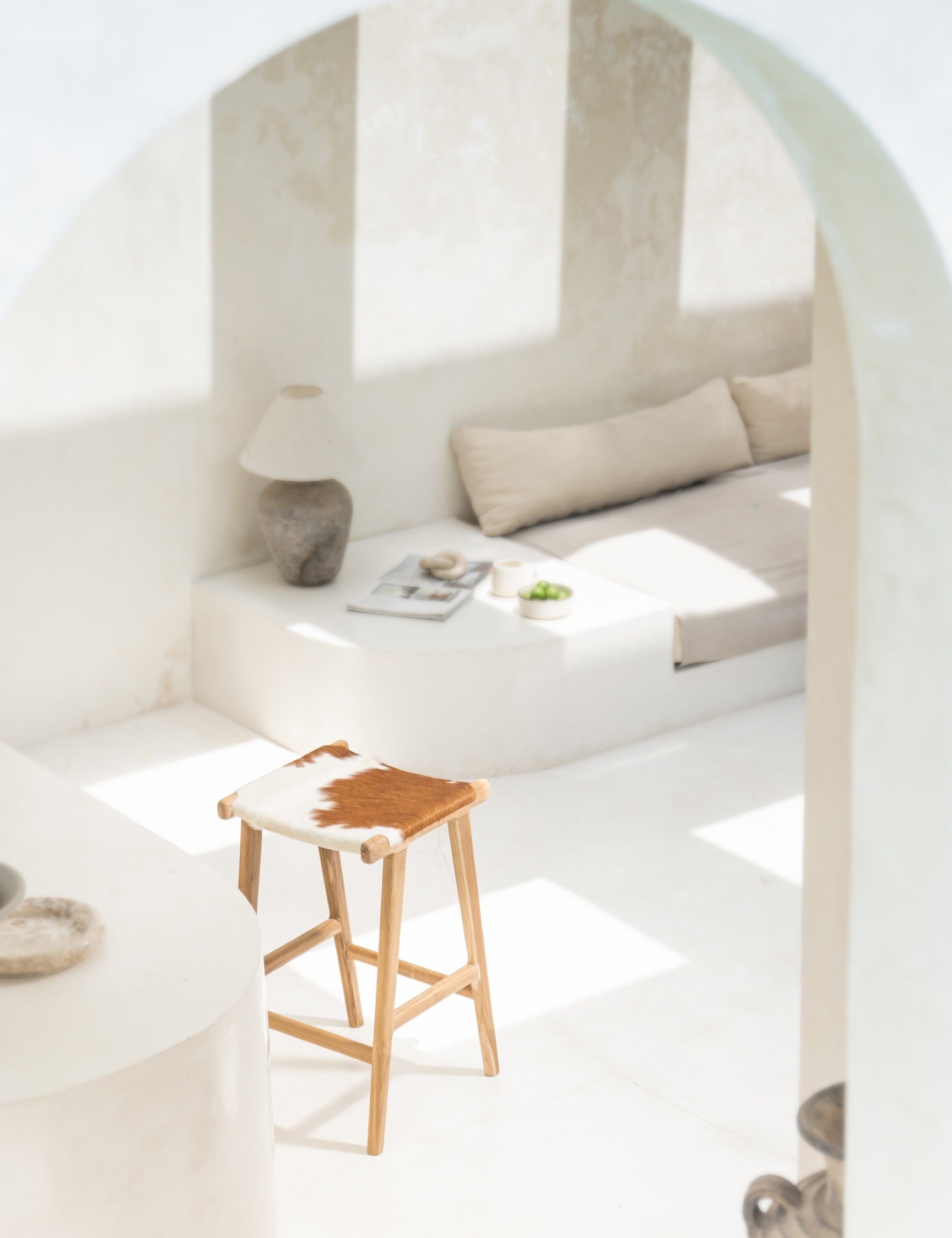 Wooden and fabric round chair in a neutral kitchen in Bali