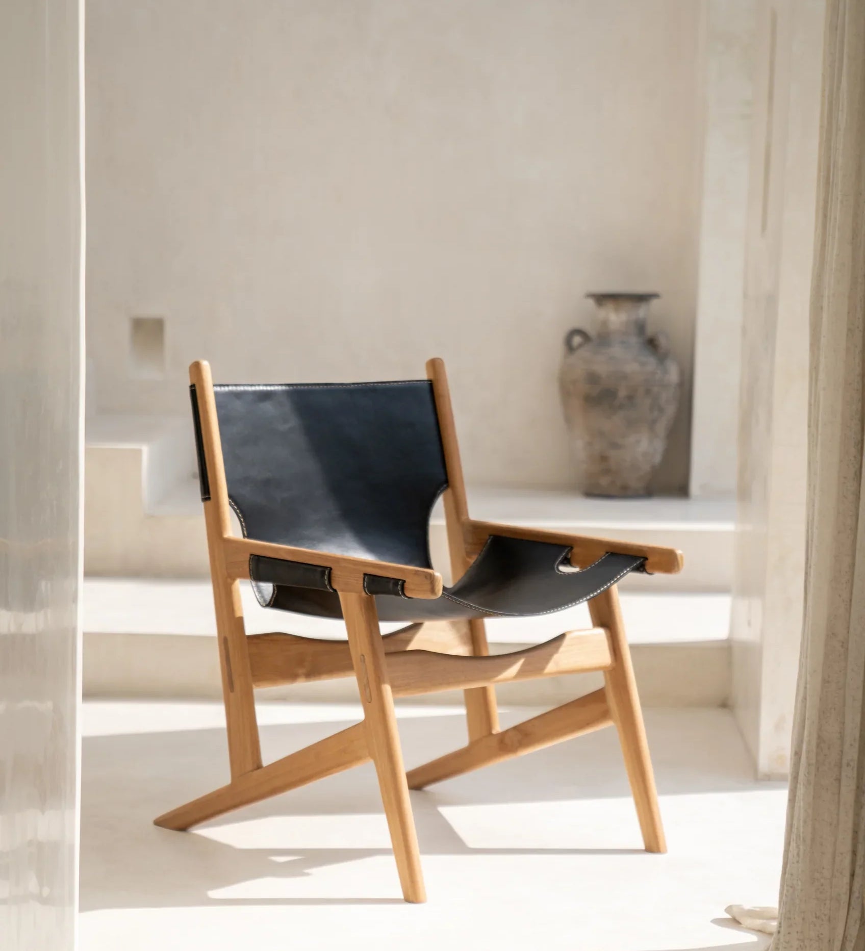 Teak and leather lounge chair by bale homewares