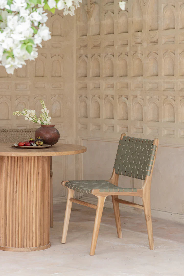 teak and leather dining chair outside 