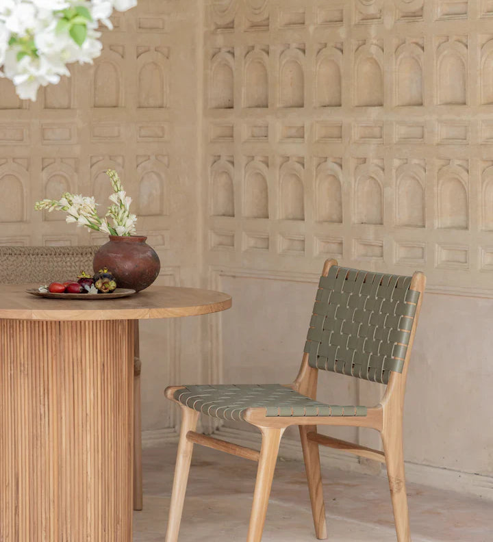 teak and leather dining chair outside 