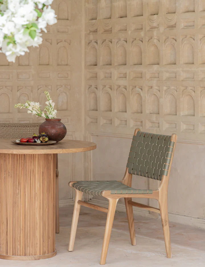 teak and leather dining chair outside 