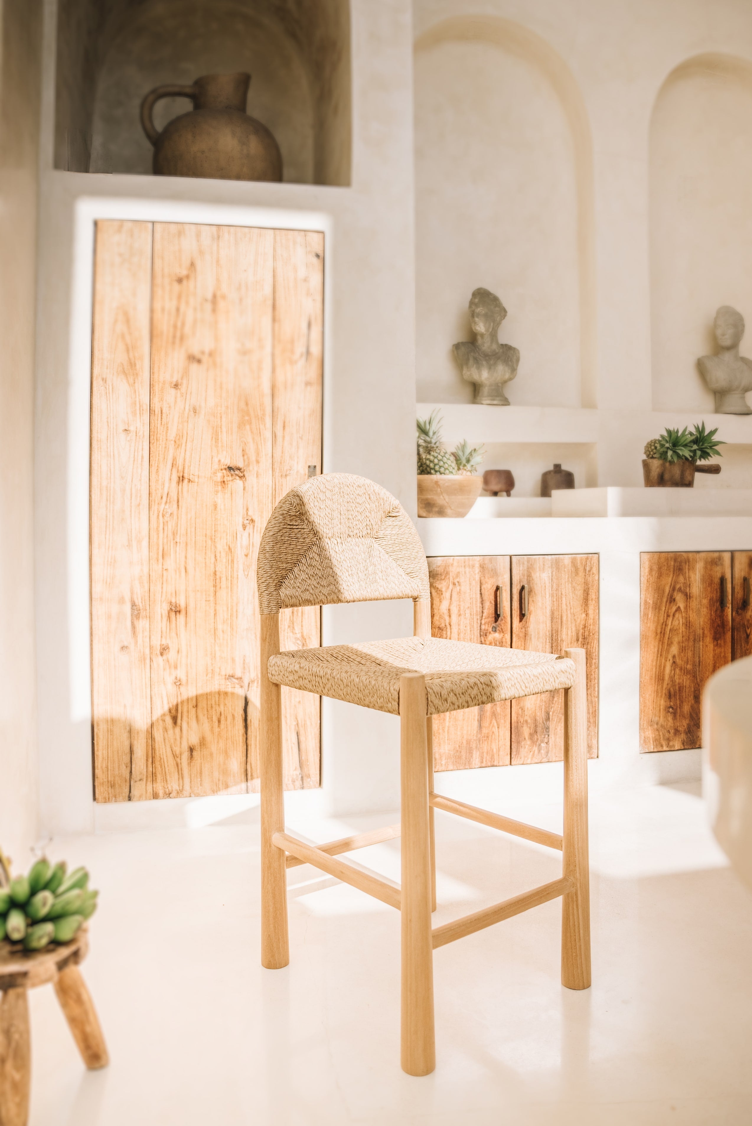 Teak bar stool in an outdoor kitchen in bali 