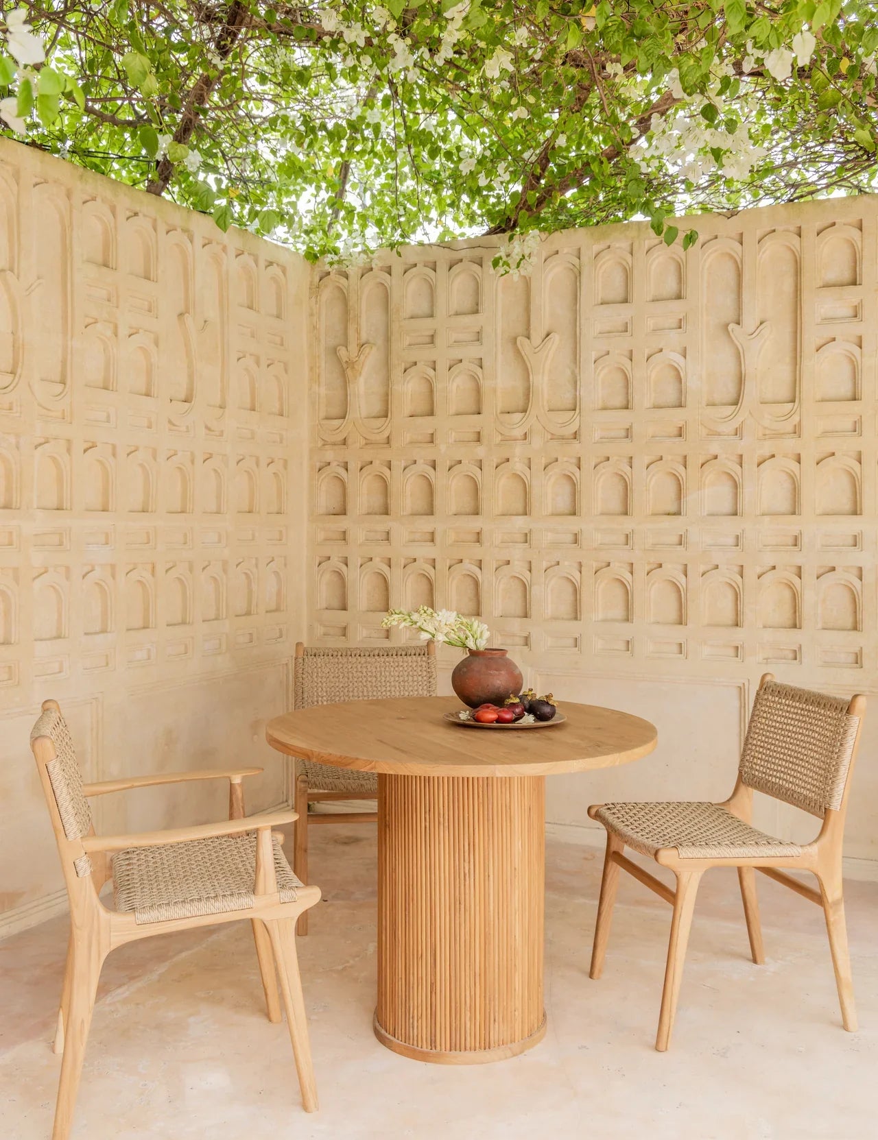 teak chairs and a teak dining table