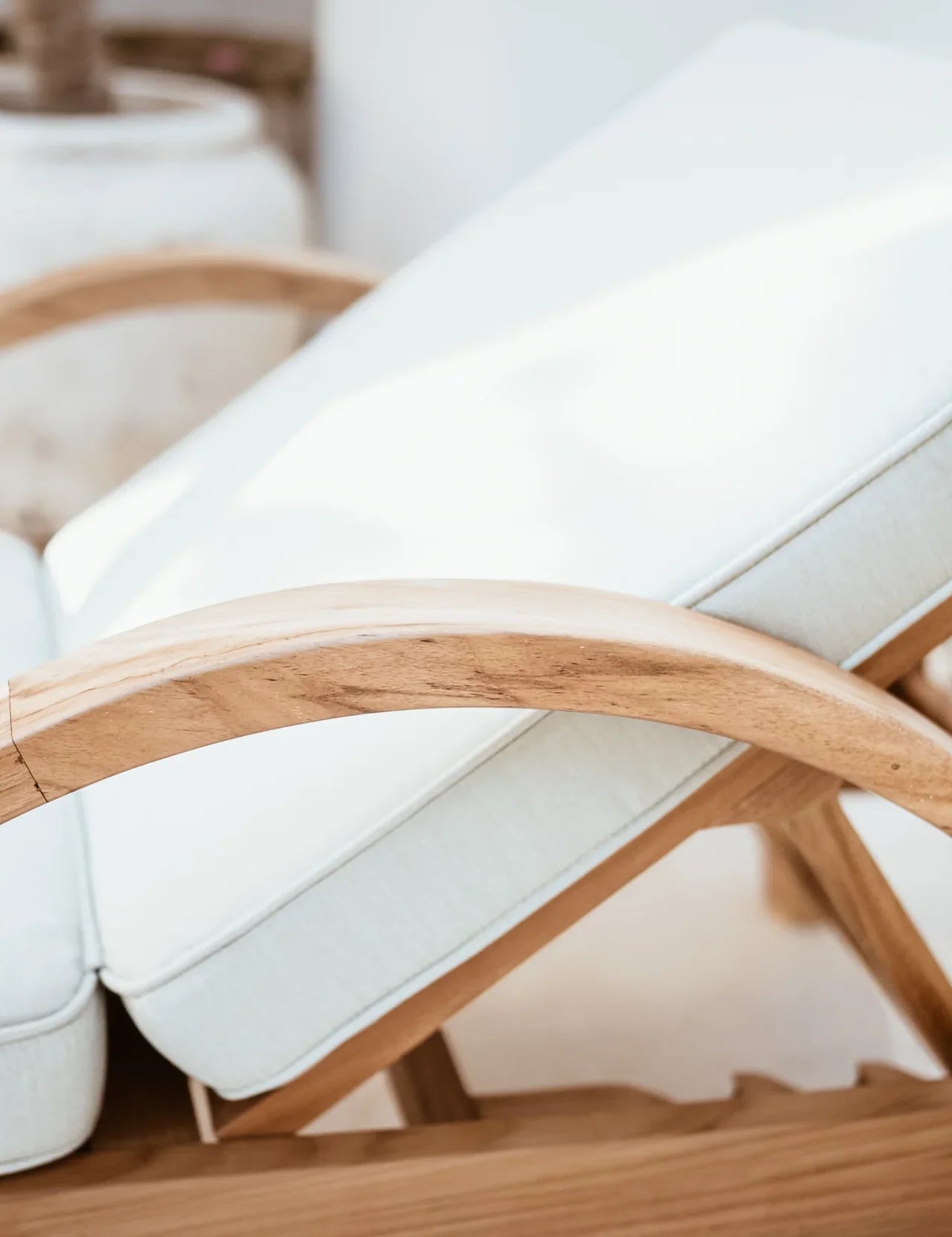 outdoor lounge chair in cream and natural teak