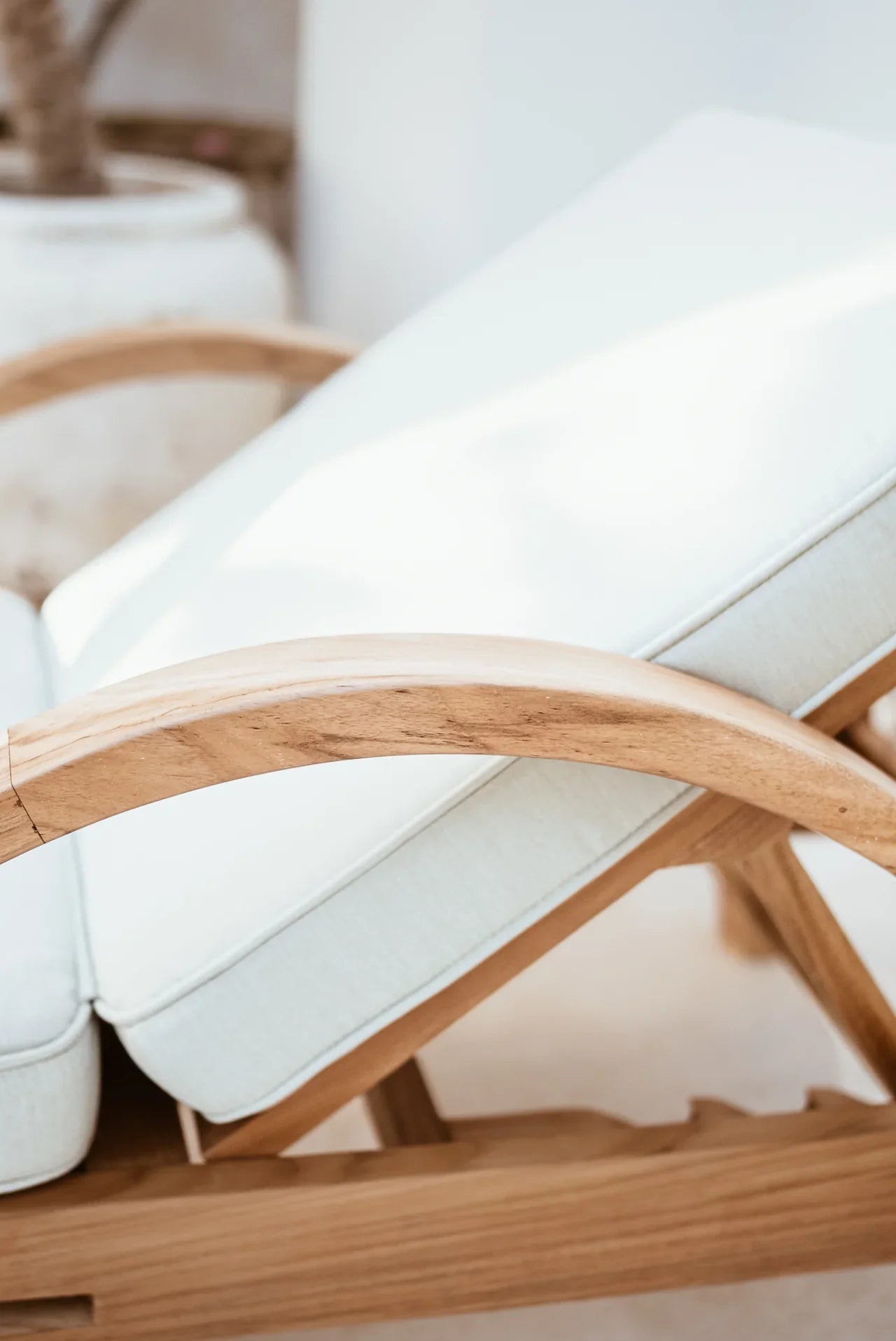 outdoor lounge chair in cream and natural teak