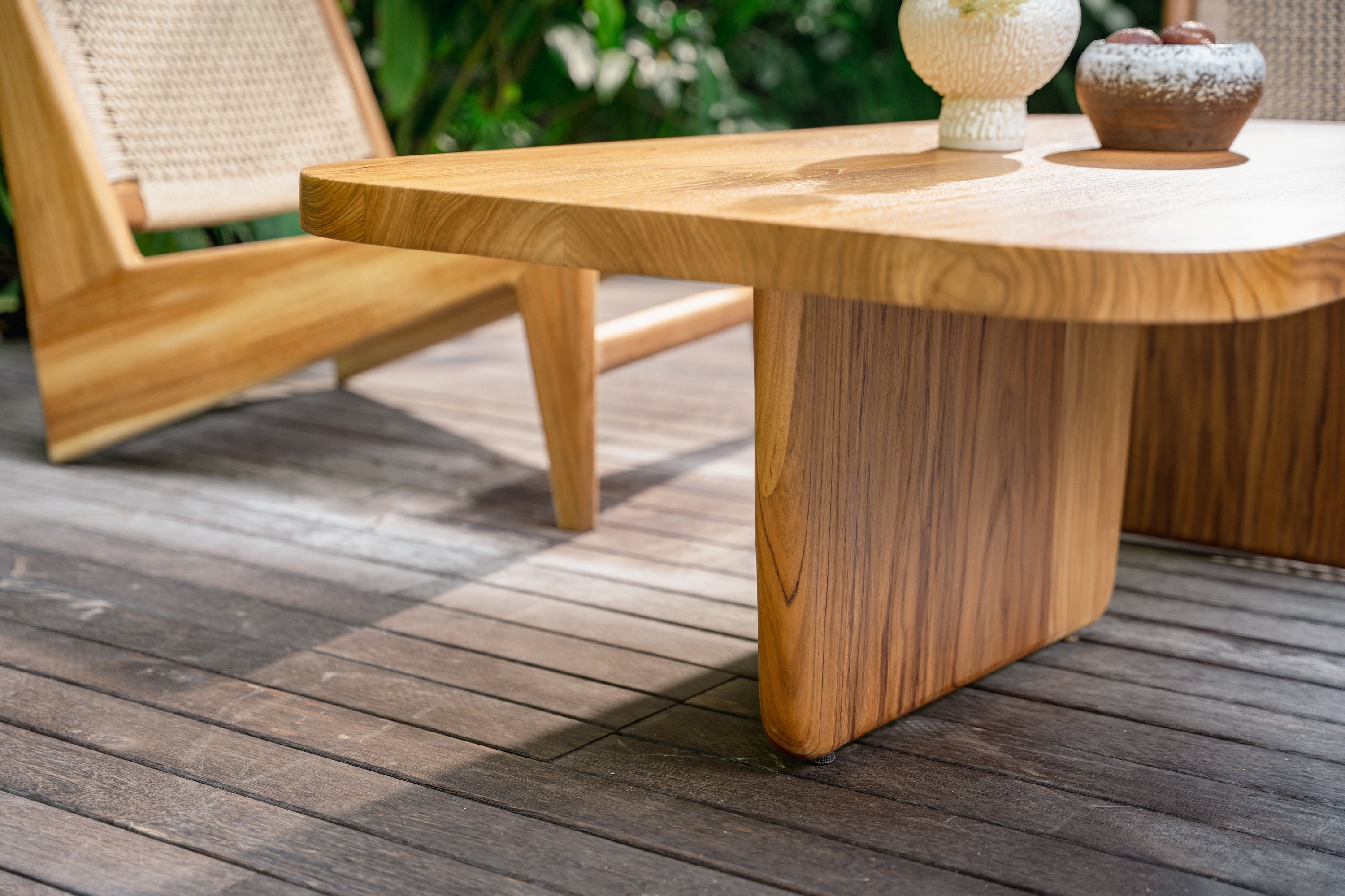 Wooden outdoor table with a chair on a wooden deck